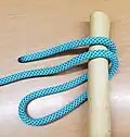 wrap the bight around the pole and under the rope.