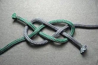 Tying starts  with a diagonal carrick bend (two colors for clarity)